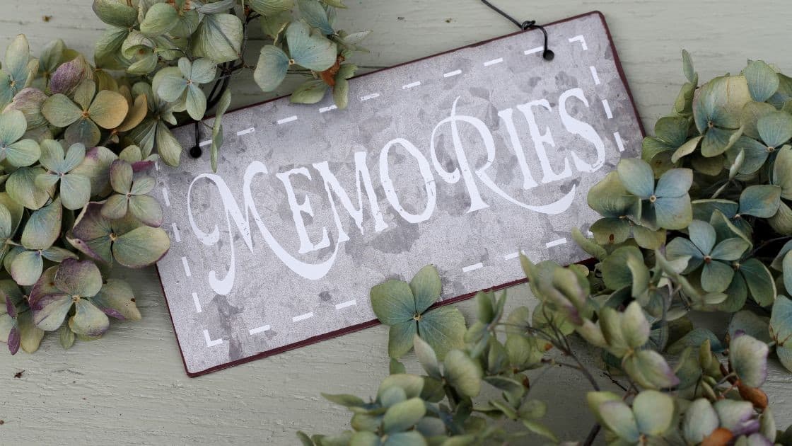 Memories sign surrounded by green and purple hydrangea flowers, rustic decorative picture for home decor.