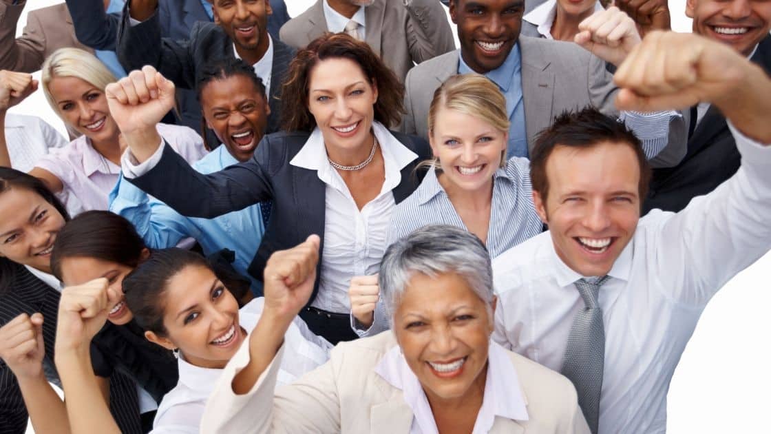 Supportive diverse business team celebrating success together.