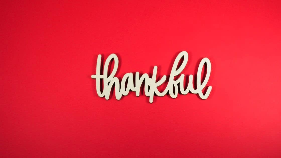 Grateful and thankful word on red background, celebrating appreciation and gratitude, suitable for thanksgiving, appreciation, and positive mindset concepts.