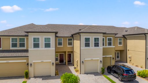 Modern townhouses with attached garages in Tampa, Florida, showcasing vibrant neighborhoods and contemporary housing options.
