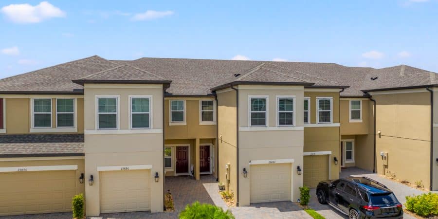 Modern townhouses with attached garages in Tampa, Florida, showcasing vibrant neighborhoods and contemporary housing options.