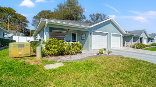Modern Tampa home with fresh exterior paint and landscaped yard, perfect for sale or rent.
