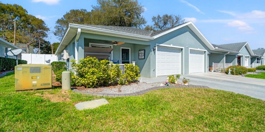 Modern Tampa home with fresh exterior paint and landscaped yard, perfect for sale or rent.